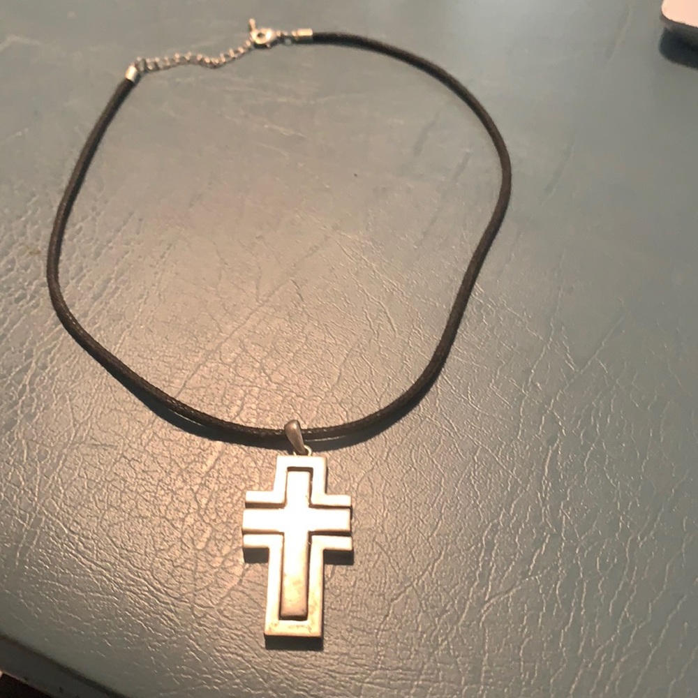 Black necklace with metallic cross
